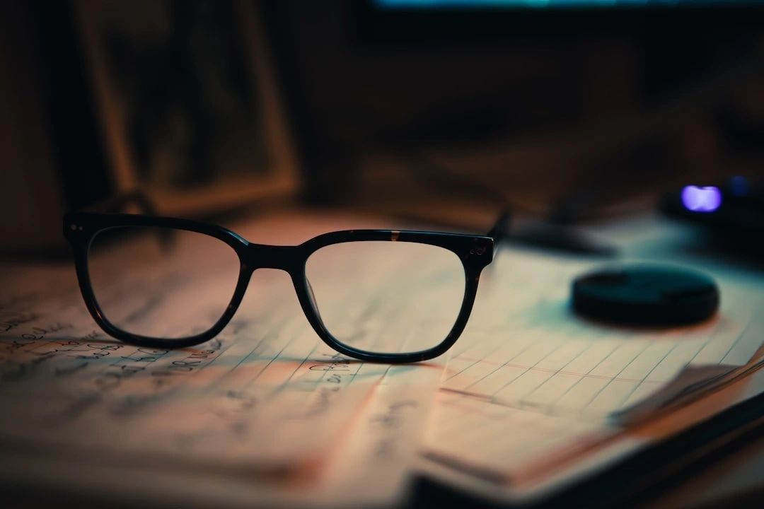 Spectacles atop handwritten notes